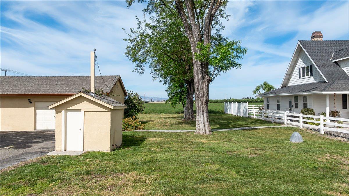 607 East Keyes Road Ceres, CA 95307 - Photo 29 of 46 view of yard with a storage shed and a garage