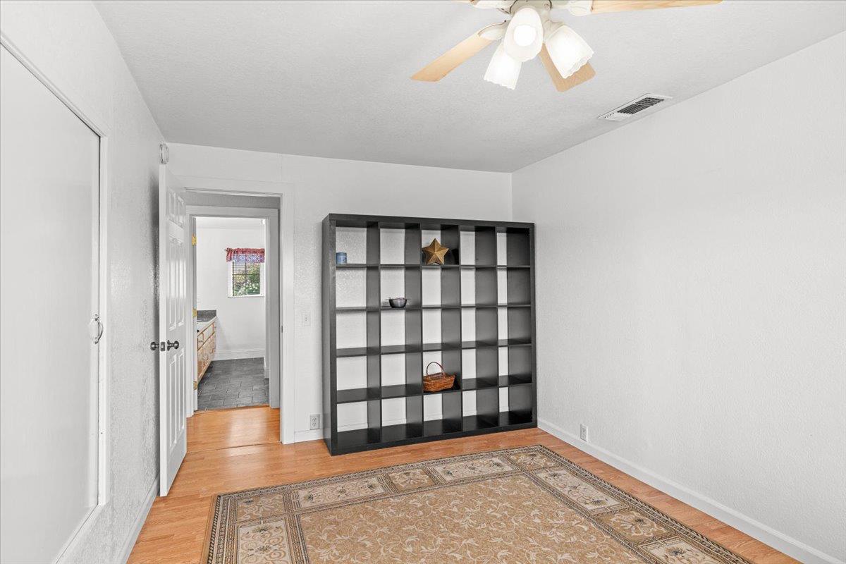 607 East Keyes Road Ceres, CA 95307 - Photo 6 of 46 Bedroom with light wood-style flooring and ceiling fan