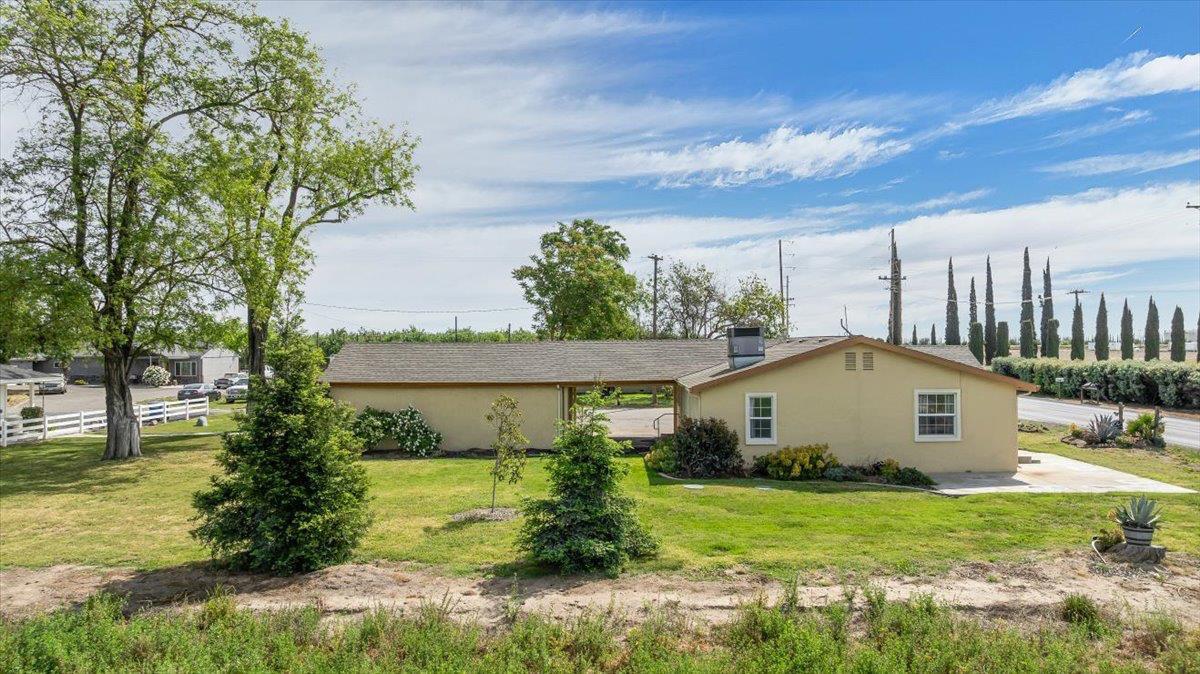 607 East Keyes Road Ceres, CA 95307 - Photo 7 of 46 view of west side of home featuring a patio and stucco siding
