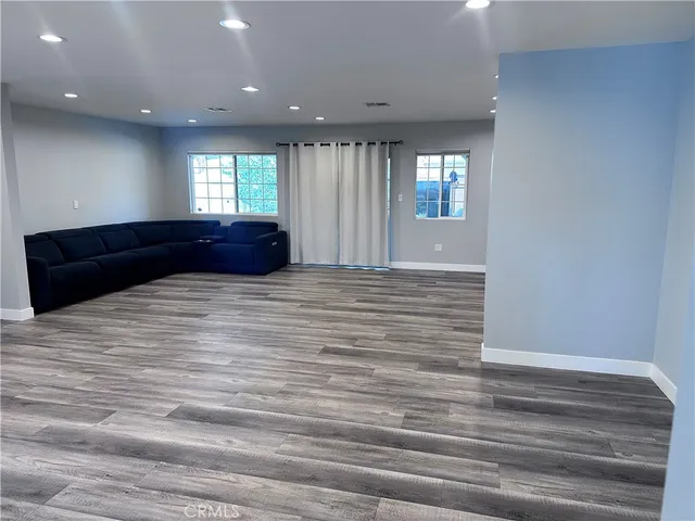 a living room with a couch and a window