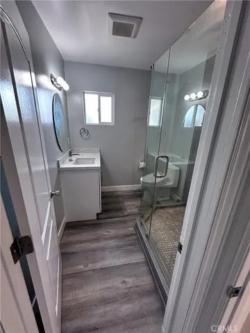 a living room with furniture and a mirror