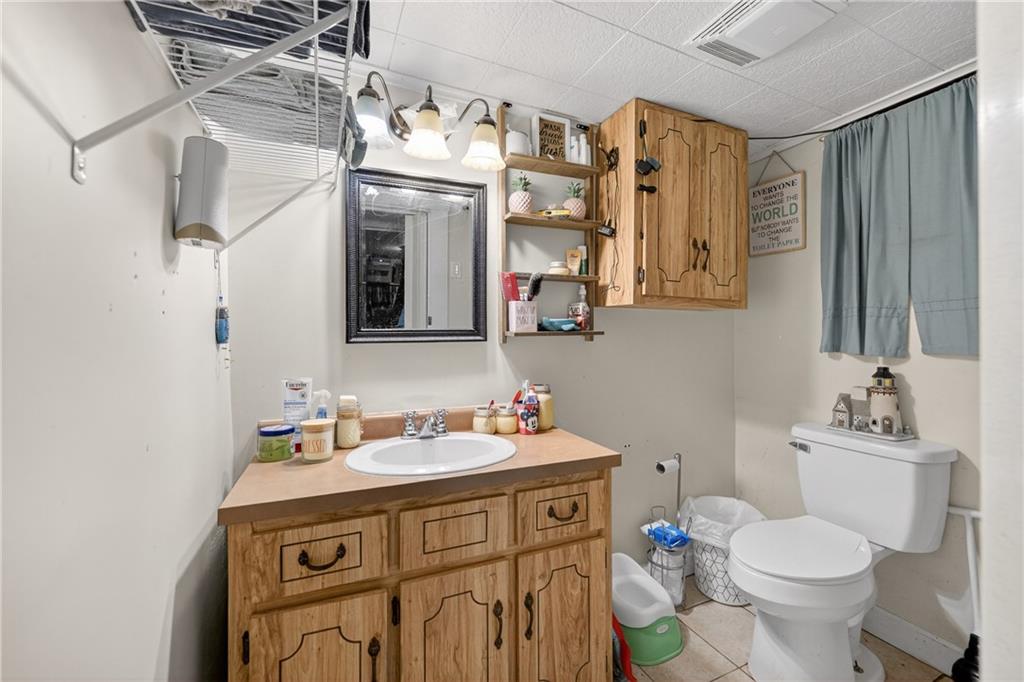 3879 Pittsburgh Road Perryopolis, PA 15473 - Photo 24 of 32 a bathroom with a sink toilet and shower