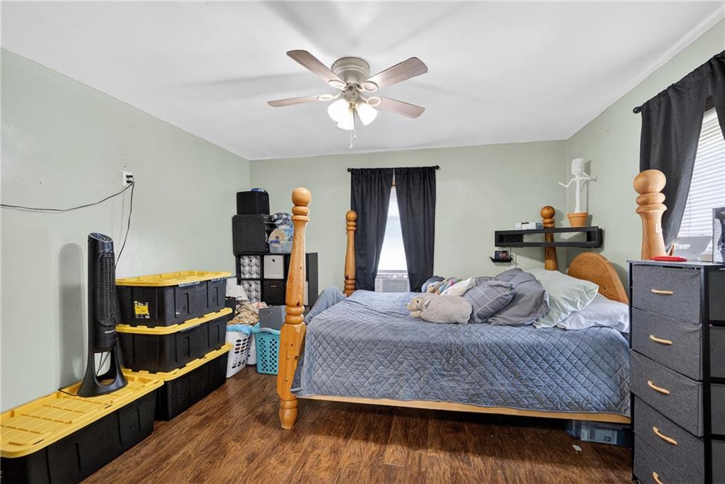 3879 Pittsburgh Road Perryopolis, PA 15473 - Photo 8 of 32 a bedroom with a bed and wooden floor