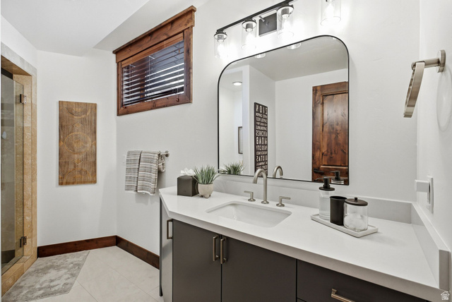 7885 North Rabbitbrush Court, Unit 13 Park City, UT 84098 - Photo 48 of 88 Bathroom vanity featuring a rectangular under-mount sink, brushed nickel faucet, and quartz countertop
