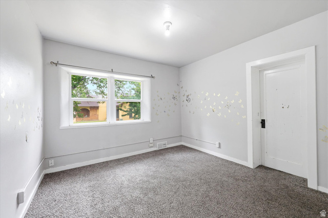 262 West 400 South Springville, UT 84663 - Photo 14 of 17 Bright room with neutral gray walls, a window offering natural light, and gray carpeting