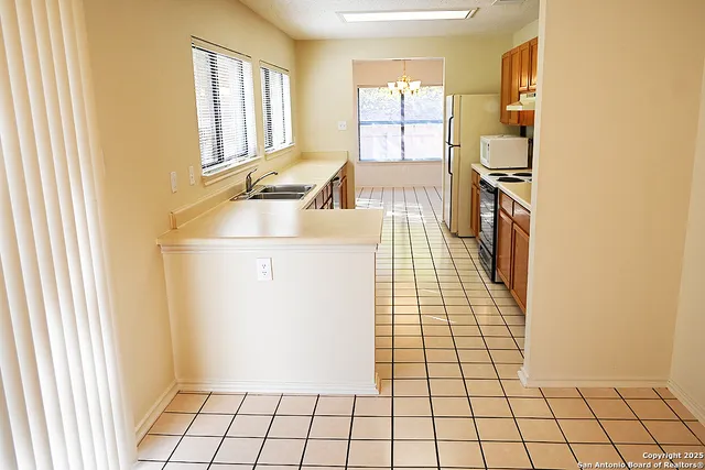 a view of a kitchen with windows