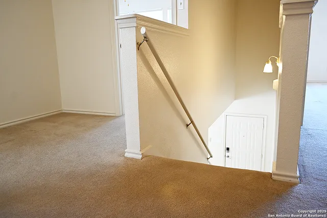 a view of a big room with windows and closet
