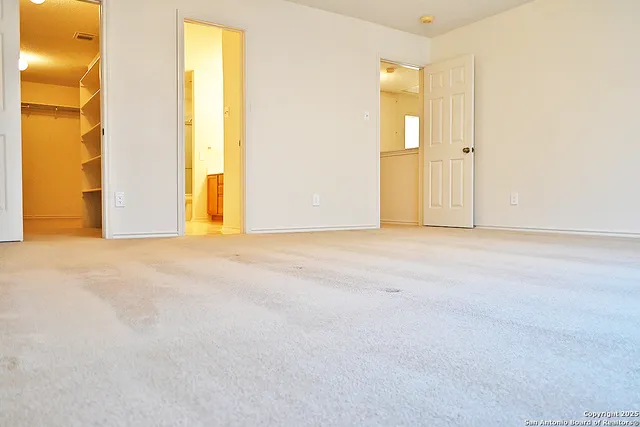a bathroom with a toilet and shower