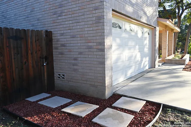 a view of a yard in front of a house with large trees