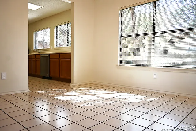 a view of a livingroom with wooden floor and a window