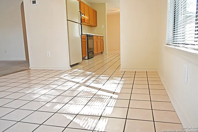 a view of a utility room with windows