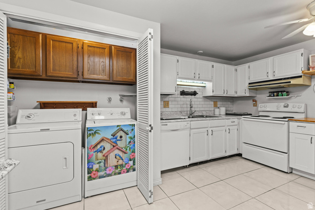 320 North 150 West Logan, UT 84321 - Photo 6 of 22 Kitchen with white appliances, decorative backsplash, under cabinet range hood, a ceiling fan, and light tile patterned floors