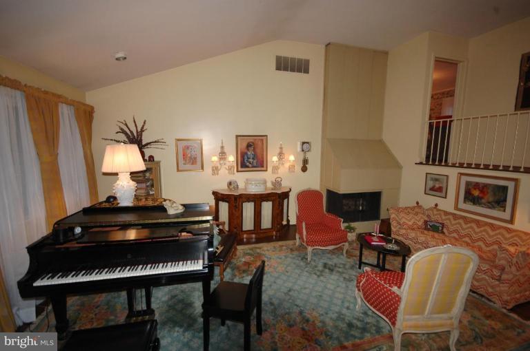 3209 Northbrook Road Pikesville, MD 21208 - Photo 2 of 13 a living room with furniture fireplace and a piano