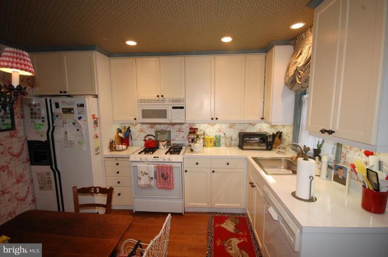 3209 Northbrook Road Pikesville, MD 21208 - Photo 5 of 13 a kitchen filled with stainless steel appliances granite countertop a sink refrigerator and cabinets