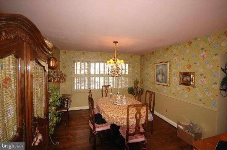 3209 Northbrook Road Pikesville, MD 21208 - Photo 6 of 13 a view of a dining room with furniture window and wooden floor