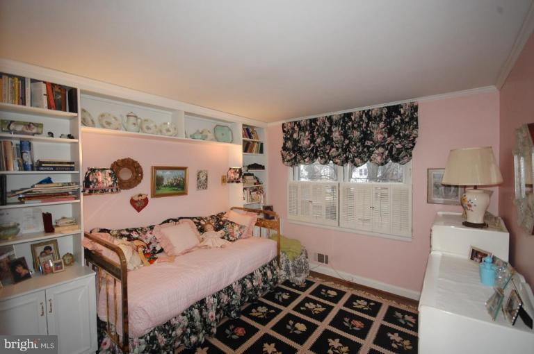 3209 Northbrook Road Pikesville, MD 21208 - Photo 7 of 13 a bedroom with a bed and a window