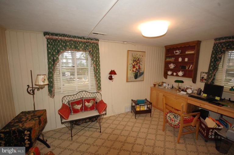 3209 Northbrook Road Pikesville, MD 21208 - Photo 8 of 13 a room with furniture a rug and a window