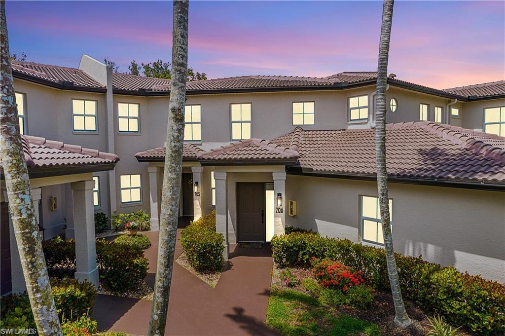 700 Diamond Circle, Unit 706 Naples, FL 34110 - Photo 1 of 37 a view of a house with a potted plant and floor to ceiling window