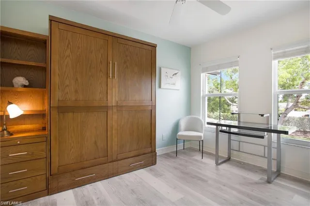 a workspace with furniture and window