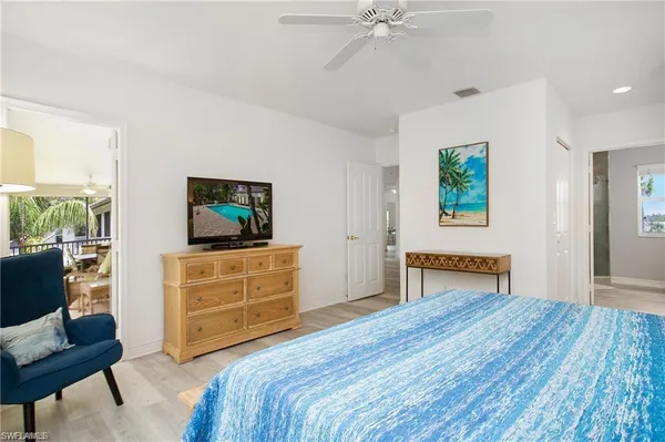 a bedroom with a bed and a dresser in it