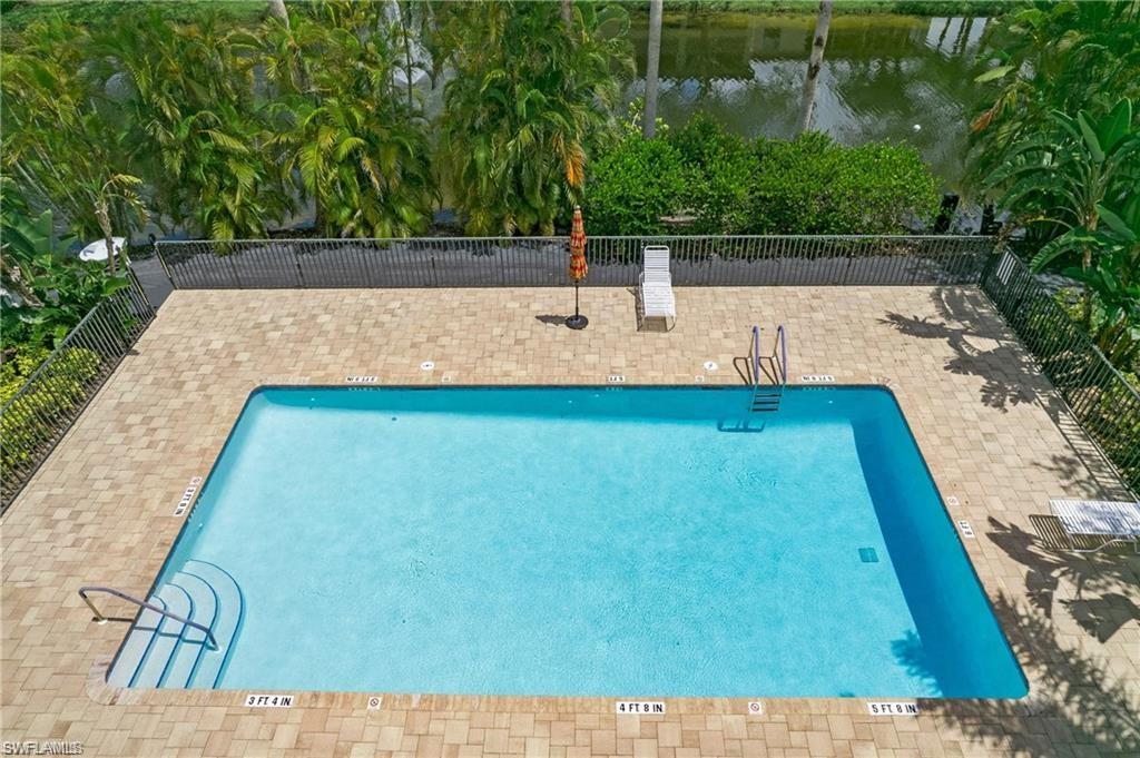 700 Diamond Circle, Unit 706 Naples, FL 34110 - Photo 34 of 37 a view of a backyard