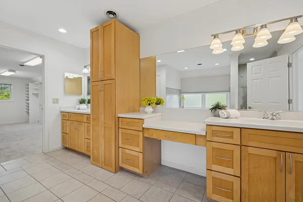 a bathroom with a sink a faucet a mirror and a bathtub