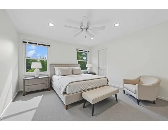 a spacious bedroom with a bed and a couch