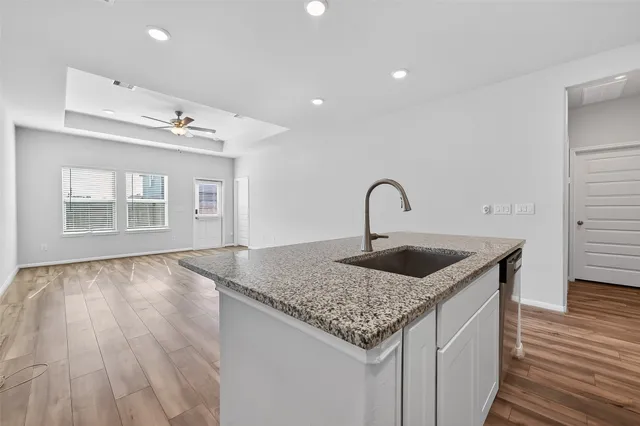 a kitchen with sink and window