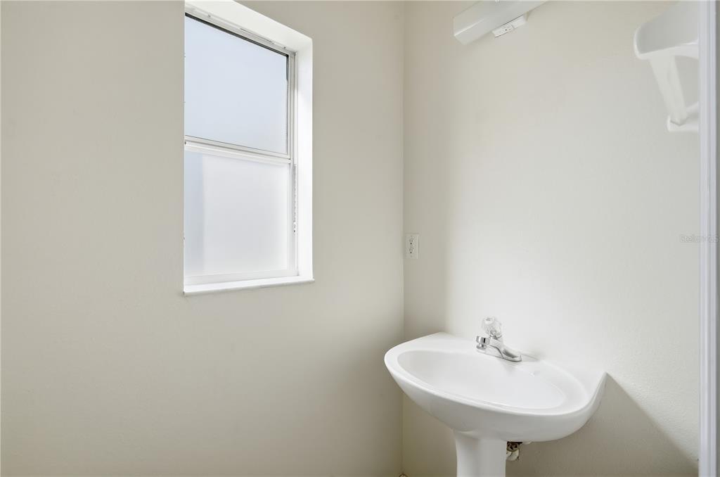 5002 Beechcraft Way Seffner, FL 33584 - Photo 15 of 26 a bathroom with a sink and a mirror
