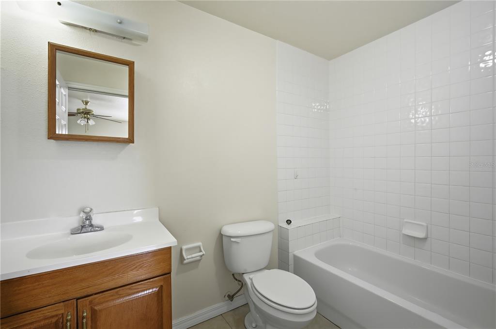 5002 Beechcraft Way Seffner, FL 33584 - Photo 16 of 26 a bathroom with a sink mirror vanity and toilet