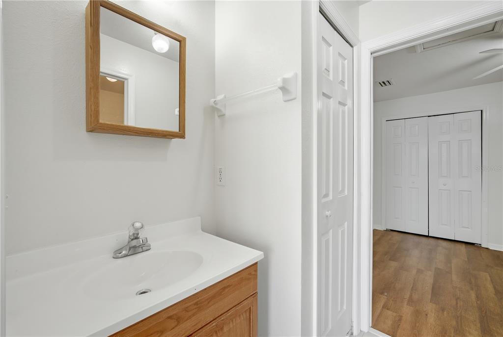 5002 Beechcraft Way Seffner, FL 33584 - Photo 17 of 26 a bathroom with a sink a mirror and shower