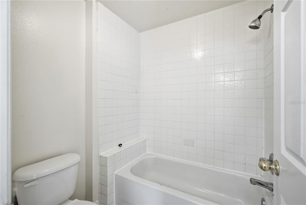 5002 Beechcraft Way Seffner, FL 33584 - Photo 18 of 26 a bathroom with a bathtub and toilet