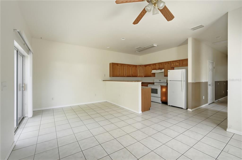 5002 Beechcraft Way Seffner, FL 33584 - Photo 5 of 26 a kitchen with stainless steel appliances a refrigerator and a stove top oven
