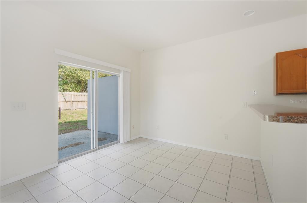 5002 Beechcraft Way Seffner, FL 33584 - Photo 8 of 26 an empty room with windows