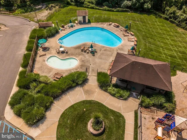 an aerial view of a house with outdoor space and lake view