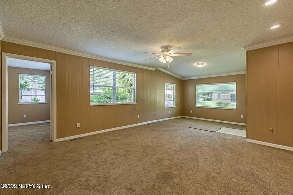 3766 South Lilly Road Jacksonville, FL 32207 - Photo 5 of 20 an empty room with windows and closet