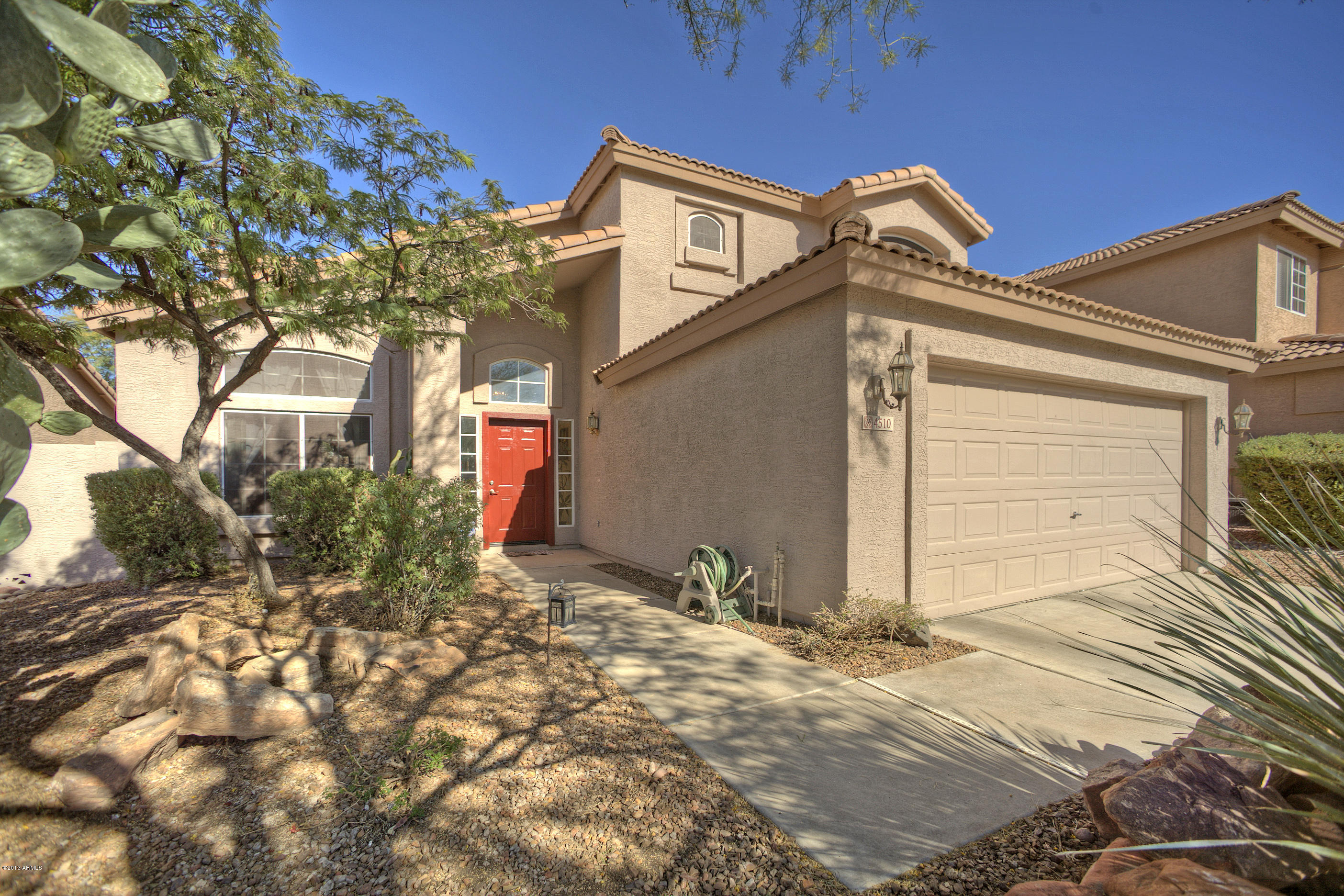 4510 East Rowel Road Phoenix, AZ 85050 - Photo 1 of 29 a front view of a house with a yard