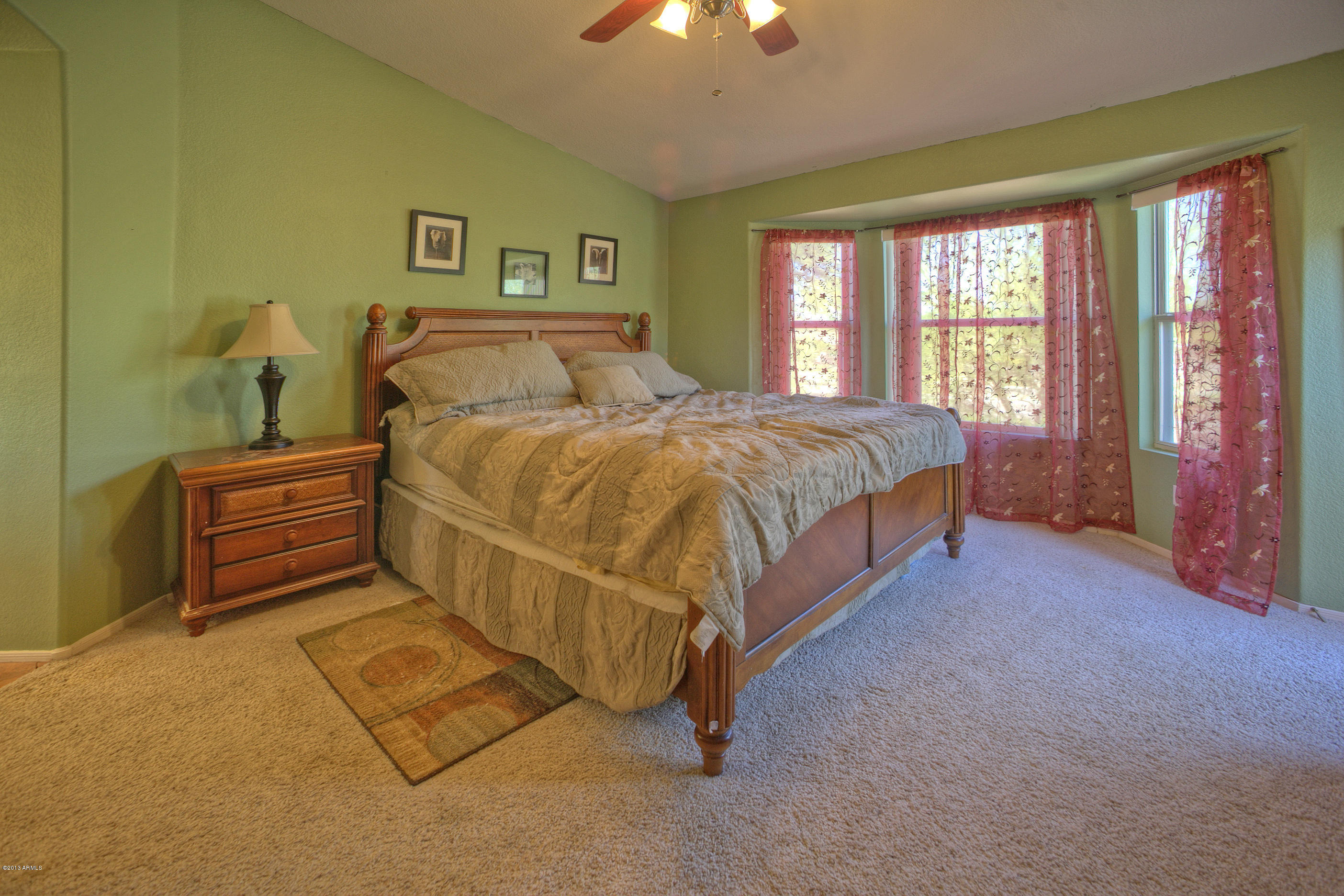 4510 East Rowel Road Phoenix, AZ 85050 - Photo 14 of 29 a bed sitting in a spacious bedroom next to a window