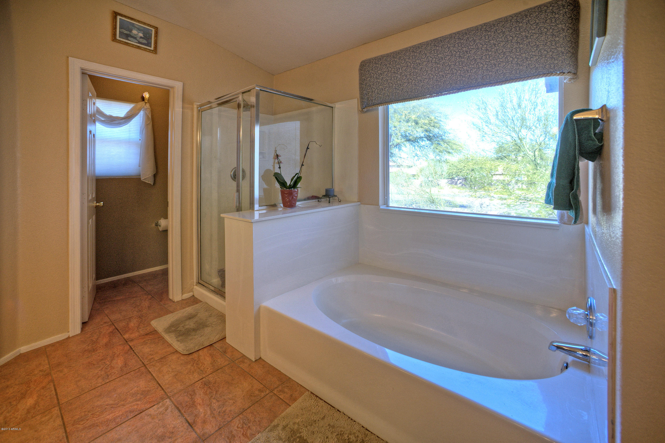 4510 East Rowel Road Phoenix, AZ 85050 - Photo 16 of 29 a bathroom with a bathtub and a shower