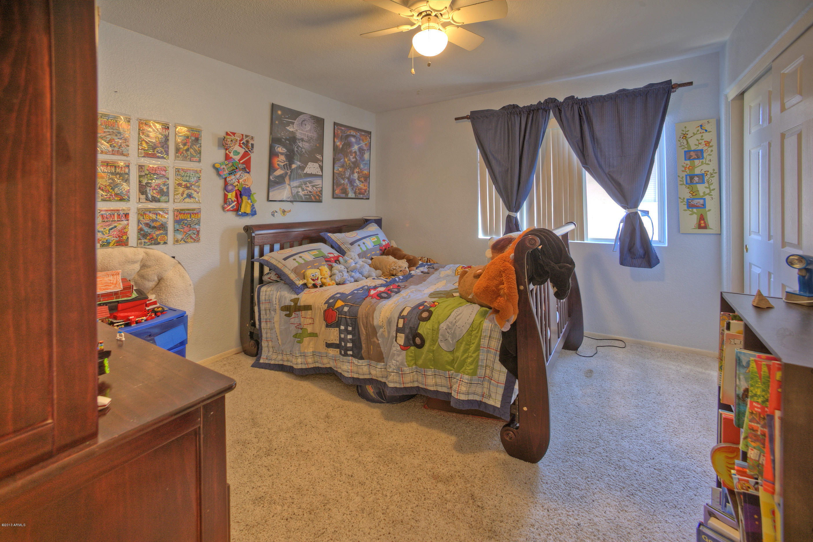 4510 East Rowel Road Phoenix, AZ 85050 - Photo 17 of 29 a bedroom with a bed and a window