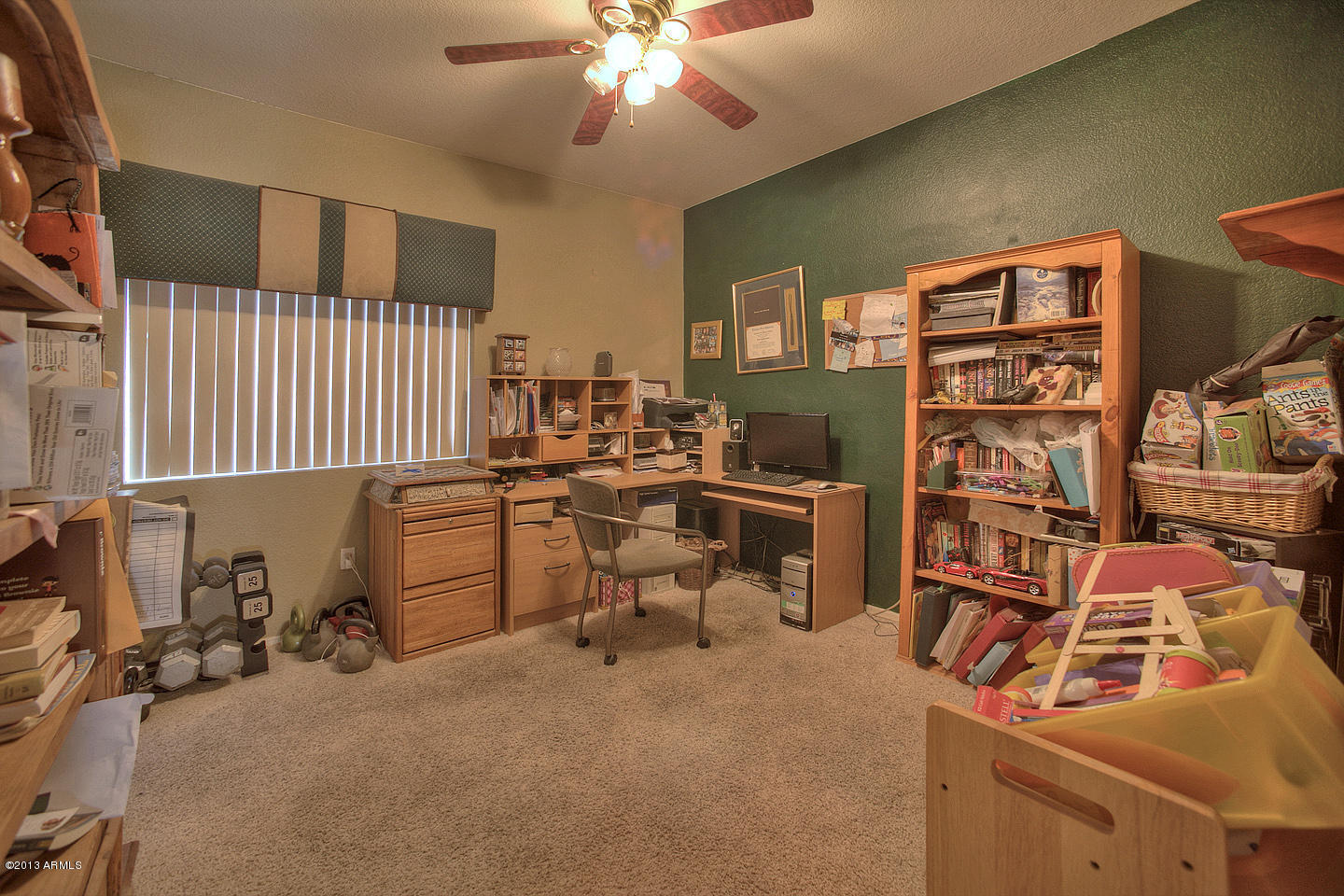 4510 East Rowel Road Phoenix, AZ 85050 - Photo 19 of 29 walk in closet with window and chandelier