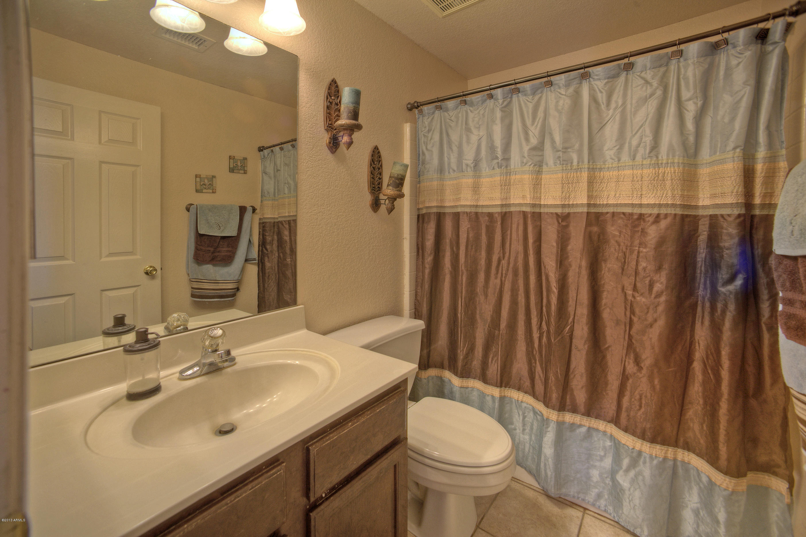4510 East Rowel Road Phoenix, AZ 85050 - Photo 20 of 29 a bathroom with a sink and a mirror