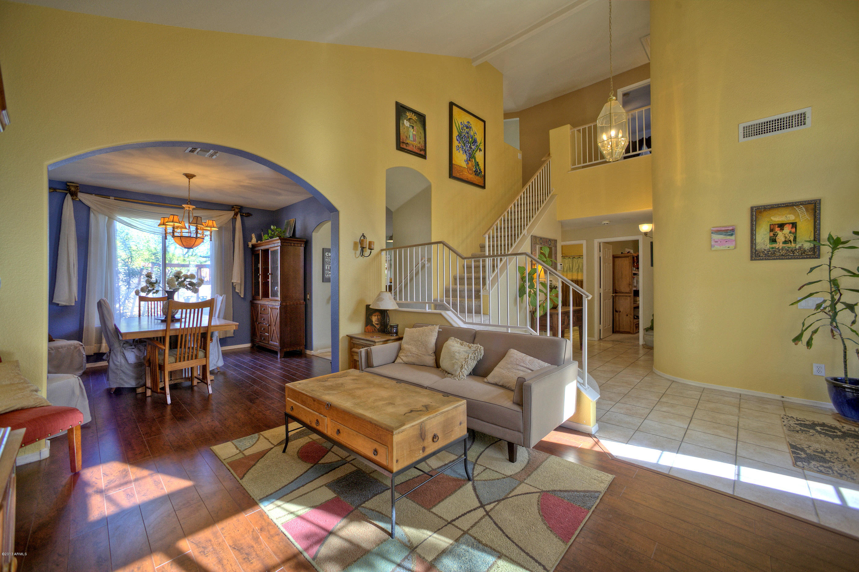 4510 East Rowel Road Phoenix, AZ 85050 - Photo 2 of 29 a living room with furniture and a dining table with wooden floor