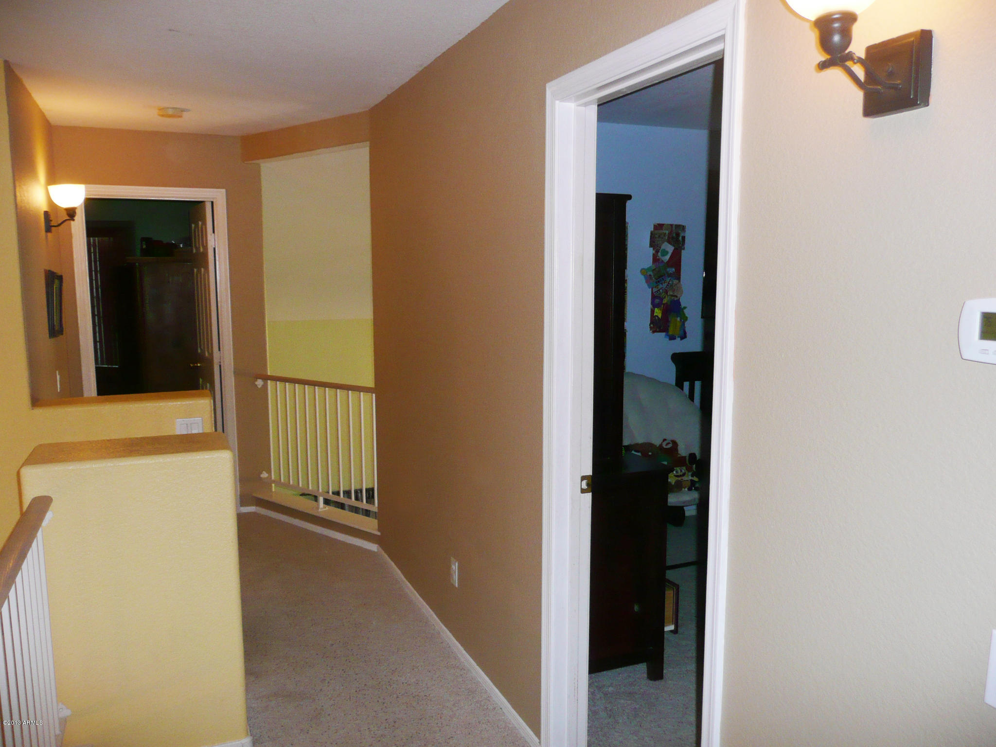 4510 East Rowel Road Phoenix, AZ 85050 - Photo 21 of 29 a view of a hallway with wooden floor and closet