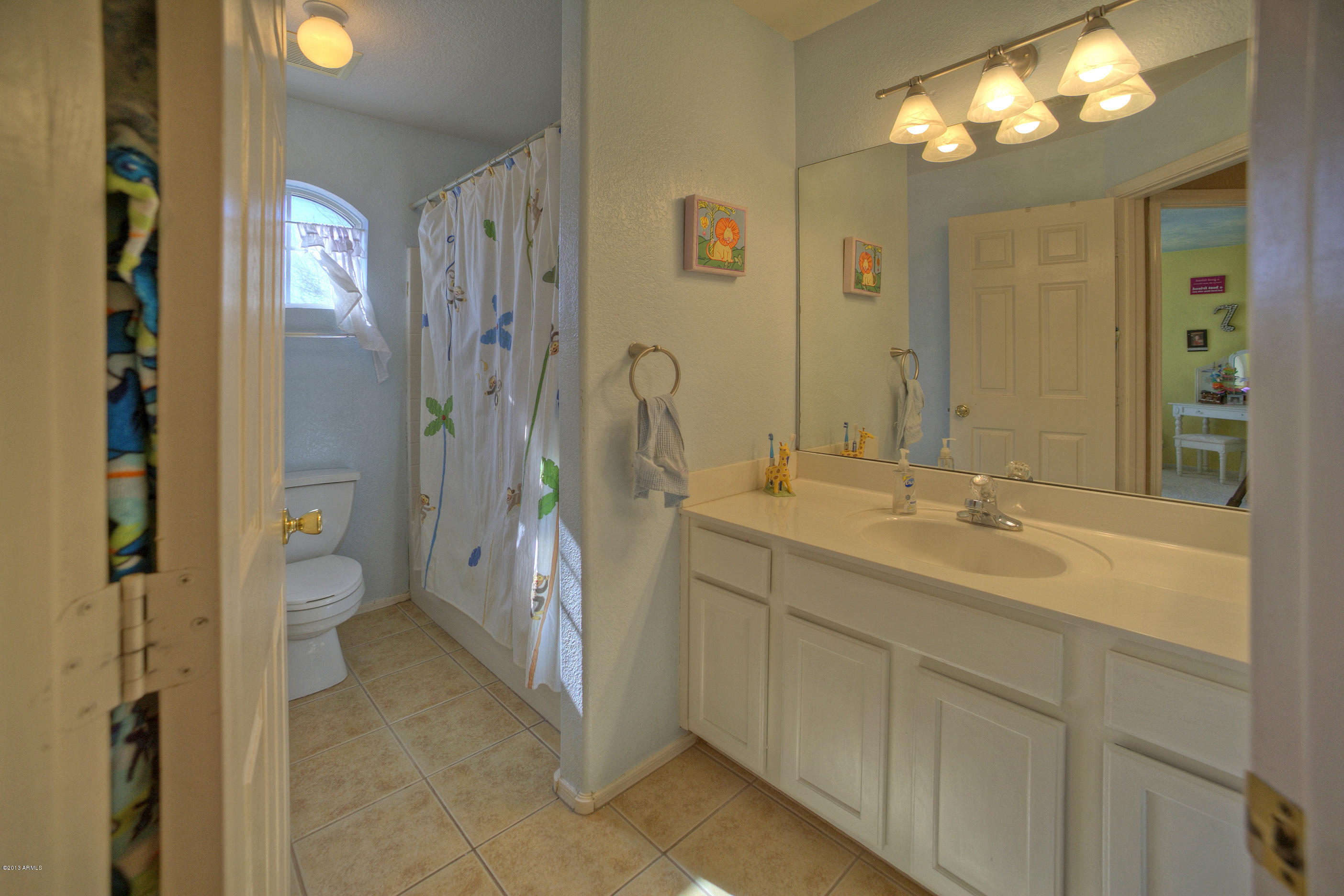 4510 East Rowel Road Phoenix, AZ 85050 - Photo 22 of 29 a spacious bathroom with a double vanity sink mirror and toilet