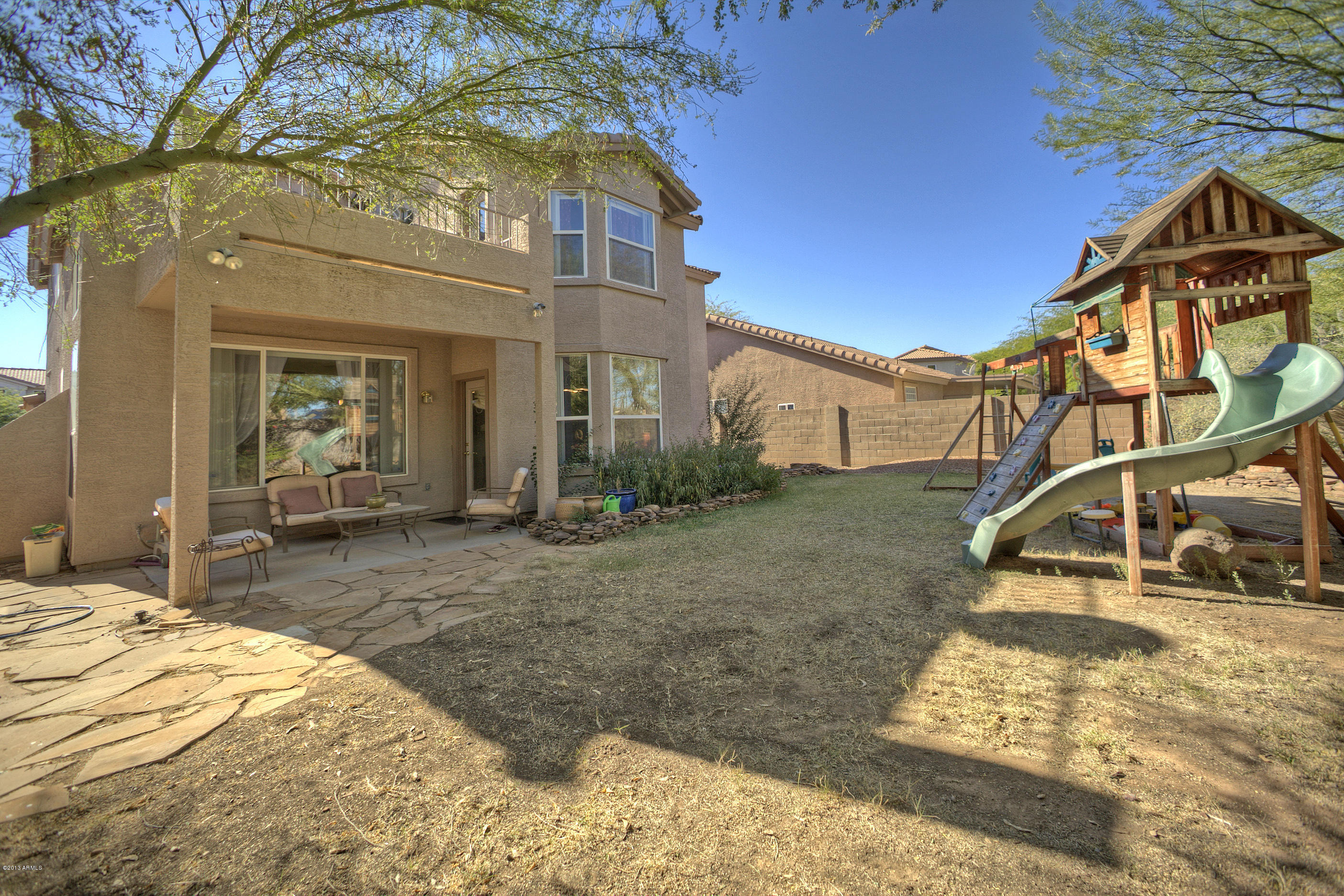 4510 East Rowel Road Phoenix, AZ 85050 - Photo 27 of 29 a view of a house with a yard