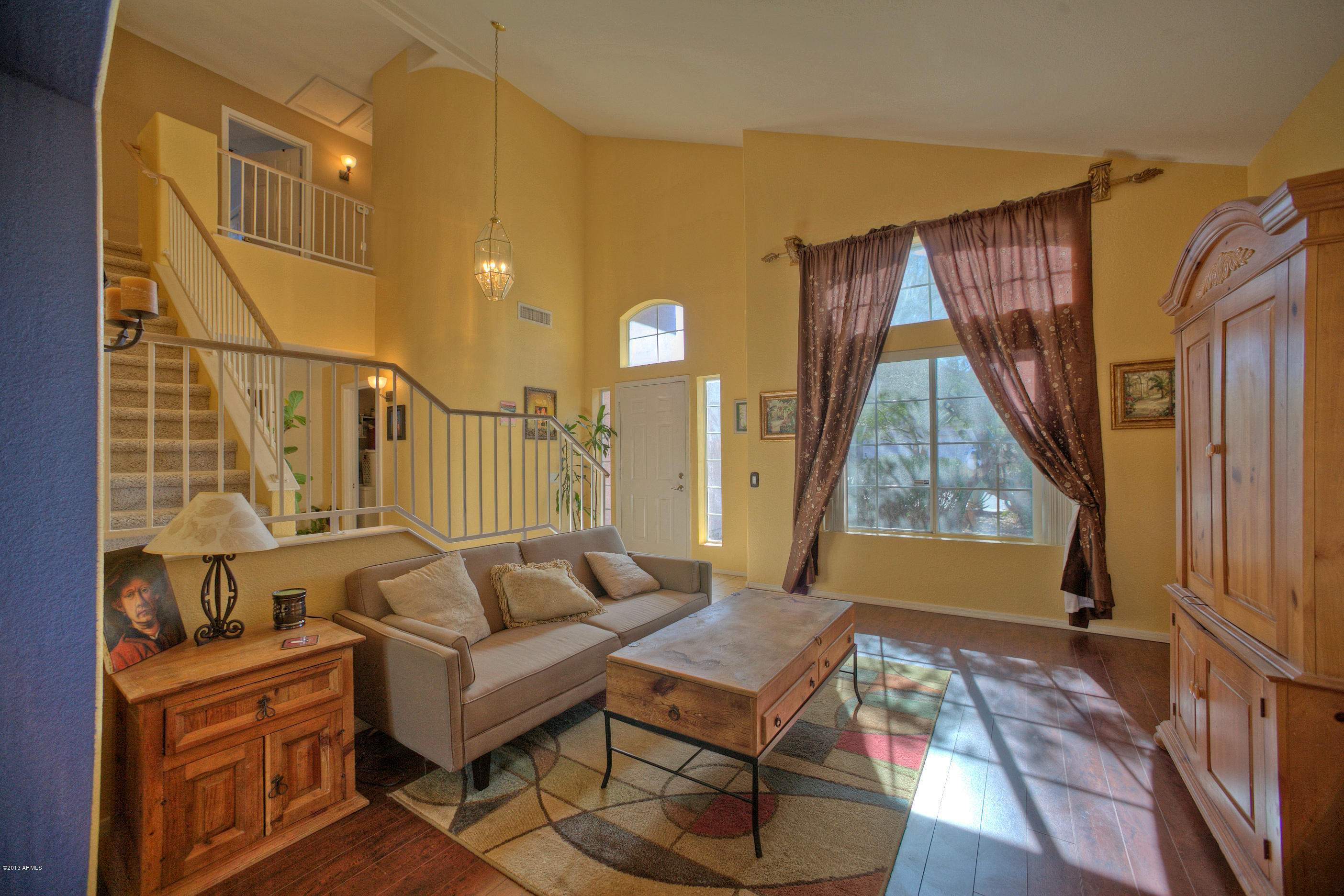 4510 East Rowel Road Phoenix, AZ 85050 - Photo 4 of 29 a living room with furniture and a window
