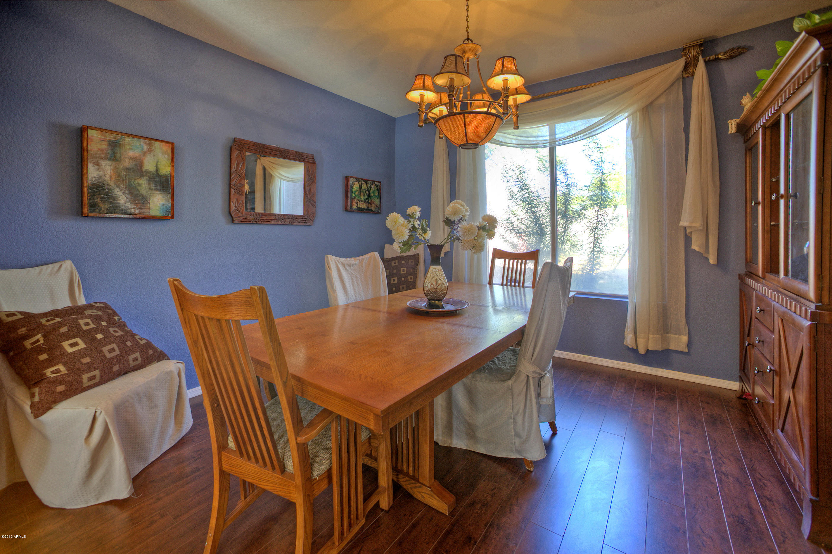 4510 East Rowel Road Phoenix, AZ 85050 - Photo 5 of 29 a view of a dining room with furniture window and wooden floor