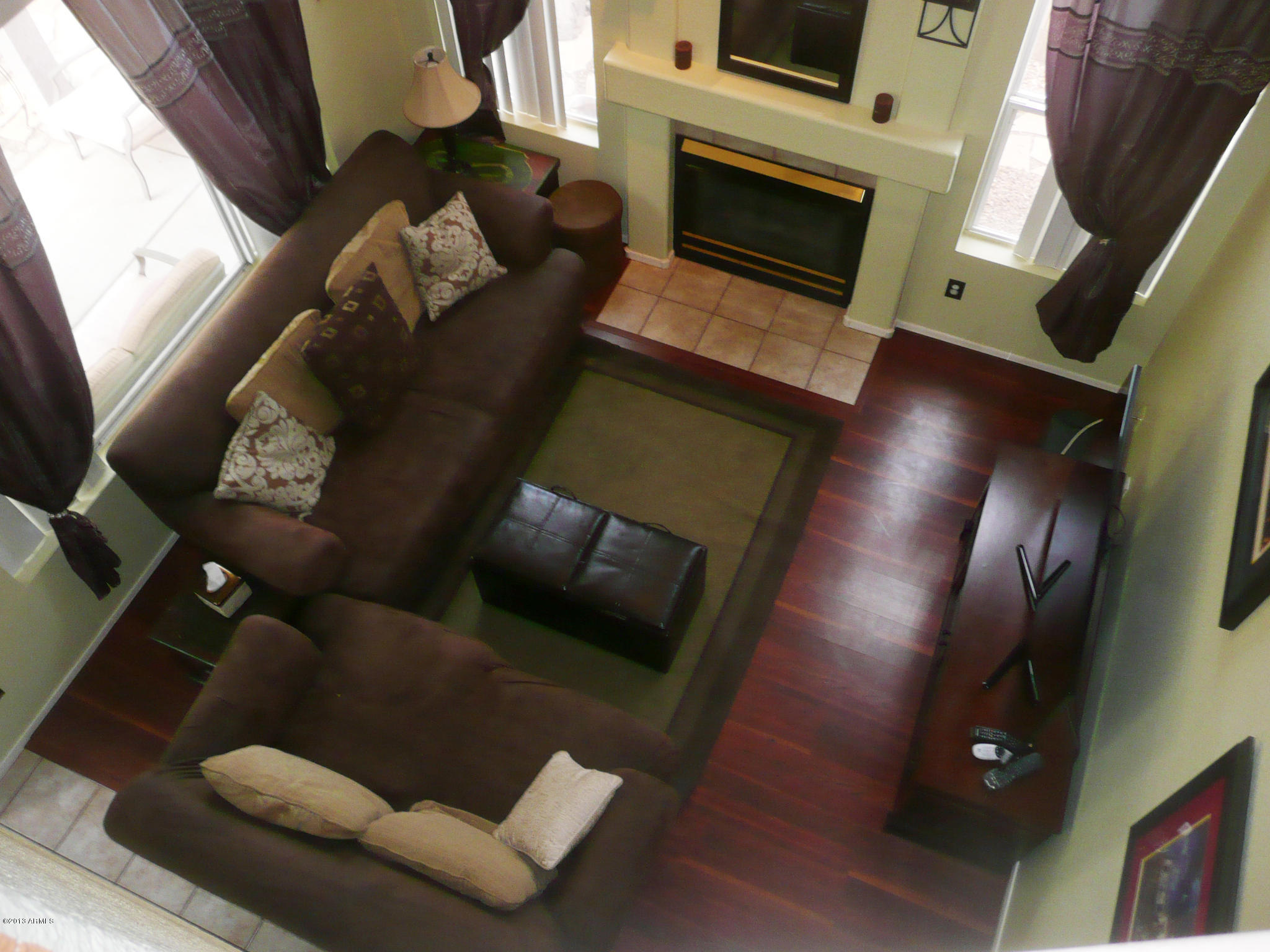 4510 East Rowel Road Phoenix, AZ 85050 - Photo 8 of 29 a living room with furniture and a fireplace