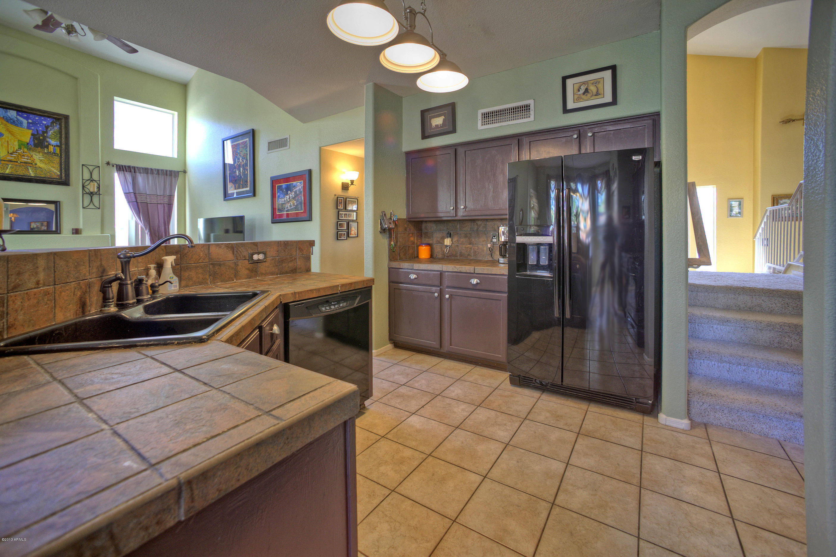 4510 East Rowel Road Phoenix, AZ 85050 - Photo 9 of 29 a kitchen with stainless steel appliances a sink and a refrigerator